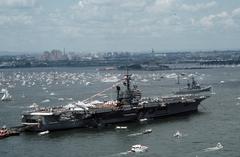 A starboard quarter view of the aircraft carrier USS John F. Kennedy (CV 67) during the International Naval Review in New York Harbor