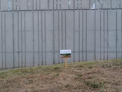 Sign promoting biodiversity with message about late mowing to allow nature to develop
