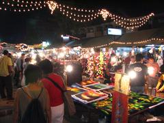 Chiang Mai Night Bazaar bustling with colorful lights and numerous stalls at night