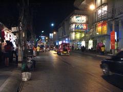 Chiang Mai Night Bazaar bustling street scene at night with colorful market stalls and vibrant lighting