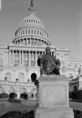 West front central section of U.S. Capitol with portico and dome featuring statue of John Marshall