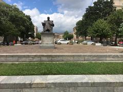 Statue of John Marshall sitting on a chair at John Marshall Memorial in Washington, DC