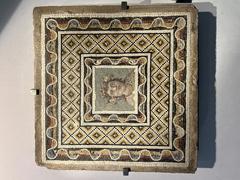 Detailed ancient mosaic artwork in Palais Massimo showcasing intricate patterns and historic design
