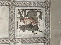 Ancient Roman mosaic floor with intricate geometric and floral patterns