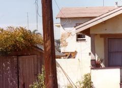 Aerial view of the aftermath of the tragic PSA Flight 182 crash on September 25, 1978, showing debris and smoke over a residential area.
