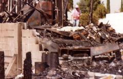 PSA Flight 182 crash site aftermath with firefighters and wreckage