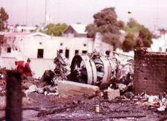 Wreckage of PSA Flight 182 crash showing damaged vehicles and debris in a residential area