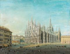 Piazza del Duomo in Milan with historic buildings and people walking