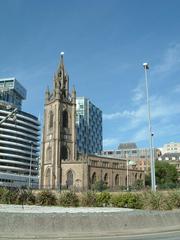 Liverpool Pier Head with historic church and waterfront buildings