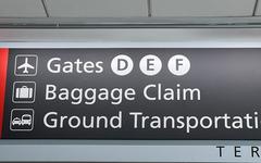 Philadelphia International Airport signage with black background, white text, and red line
