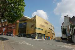 Modern new foyer interior at Colston Hall in Bristol with wooden architectural features and glass railings