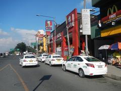 View of Old Capitol Site and City Mall beside PhilCoa footbridge with Commonwealth Avenue in Quezon City, Philippines
