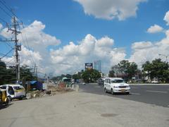 Commonwealth Avenue with San Jose Ang Tagapagtanggol Parish Church and Barangay Holy Spirit in Quezon City