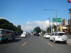 City Mall and PhilCoa footbridge beside Commonwealth Avenue near Old Capitol Site Quezon City with visible streets San Vicente and Carlos P. Garcia Avenue