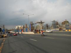 Intersection of Commonwealth Avenue and Batasan Road in Batasan Hills, Quezon City with visible traffic and street signs