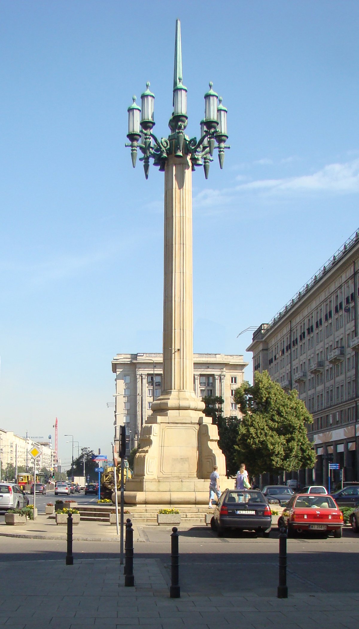 Giant lamp-post in Constitution Square, Warsaw under a cloudy sky