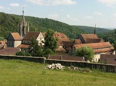 Scenic view of Kloster Bebenhausen, a former Cistercian monastery near Tübingen, Baden-Württemberg, surrounded by lush greenery and forest