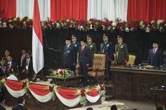 Outgoing Indonesia President Susilo Bambang Yudhoyono and President-elect Joko Widodo standing side by side during inaugural ceremonies