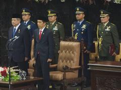 Outgoing Indonesia President Susilo Bambang Yudhoyono and President-elect Joko Widodo standing side-by-side at Widodo's inaugural ceremony