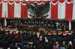 Indonesians singing national anthem at President Joko Widodo's inauguration