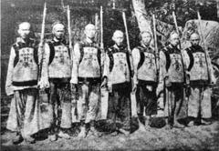 Guards standing in traditional uniforms in Shanghai Old City