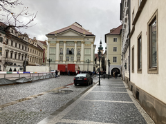 Prague cityscape with historic buildings and a river view