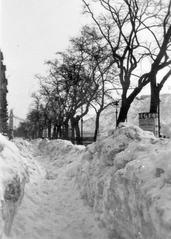 Winter scene of Dunakorzó promenade along the Danube river covered in snow