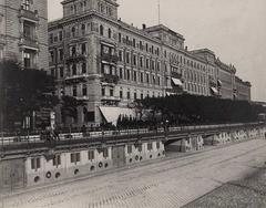 Grand Hotel Hungária on the Danube riverbank in the 1910s with an unidentified person