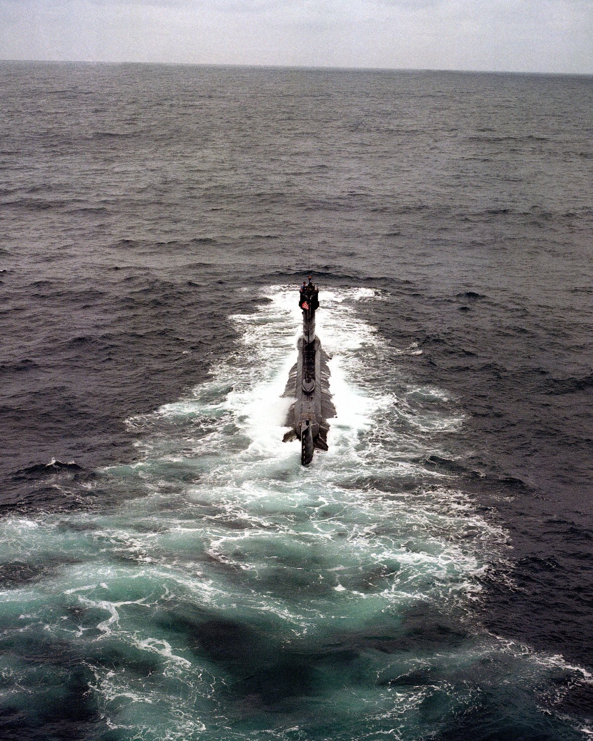 Stern view of the research submarine USS Dolphin AGSS 555 underway
