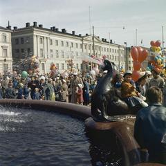 People celebrating Vappu at Havis Amanda statue in Helsinki during 1950s with Helsinki City Hall in the background