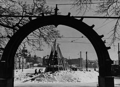Winter War in Finland. Fragment protection being constructed to shield the Havis Amanda statue. Esplanadi Chapel gate in the foreground.