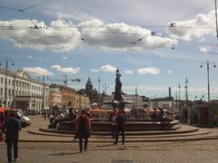 Havis Amanda statue in Market Square Helsinki with 19th century waterfront buildings and Uspenski cathedral in background