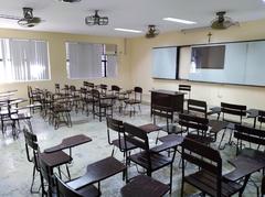 College of Science classroom 109 interior at De La Salle University – Dasmariñas showing desks and whiteboard