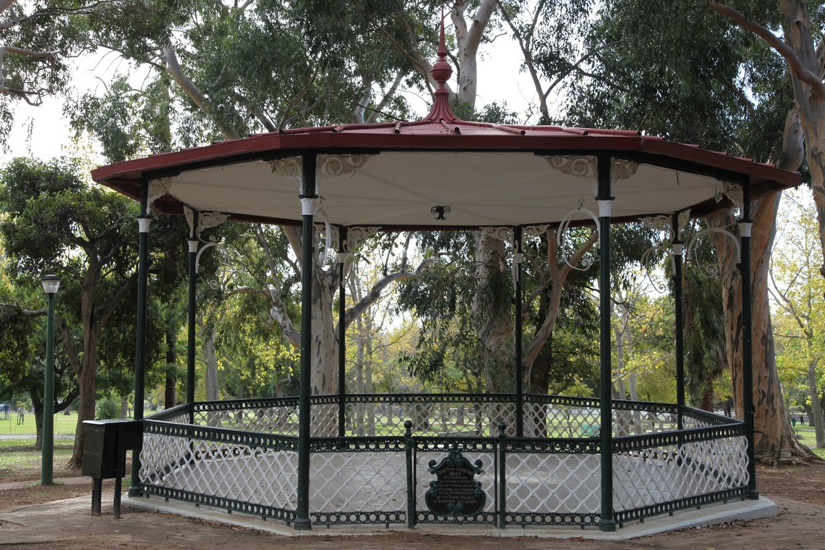 The De Waal Park bandstand built in early 1900s, located in a green park with trees and a pathway