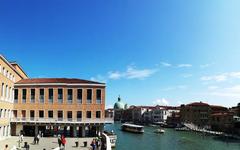 Ponte della Costituzione bridge in Venice with tram and pedestrians