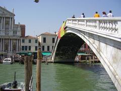 Bridge over the Grand Canal in Venice with Venetian architecture in the background