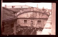 Bridge of Sighs in Venice with stone facade, statues and ornately carved stone bars