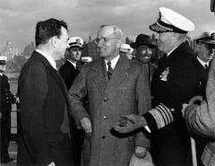 President Harry S. Truman and Admiral Jonas H. Ingram talking to New York Governor Thomas Dewey on the deck of the U.S.S. Missouri on Navy Day