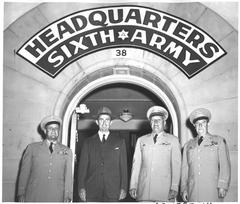 General Milton B. Halsey, Secretary of Army Frank Pace, Lieutenant General Joseph M. Swing, and Brigadier General William T. Sexton standing in front of Sixth Army Headquarters