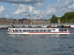 Sightseeing boat near Skeppsholmsbron bridge in Stockholm