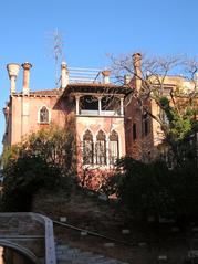 Rear view of Ca' Dario palace in Venice with ornate architecture and waterfront
