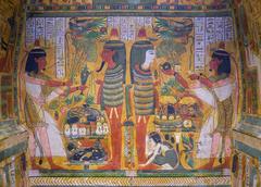Painted interior panel from coffin of Sennedjem showing deceased and wife offering to Osiris and Isis with detailed ritual objects