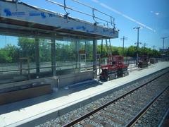 View from left window of a train traveling from Union to Pearson with trees and sky visible