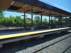 View through left window on train journey from Union Station to Pearson Airport with urban scenery and railway tracks