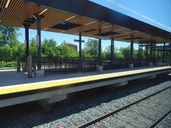 View from left window of a train traveling from Union to Pearson station, showing urban landscape and railway tracks
