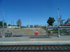 View through a left window during a train trip from Union to Pearson showing urban and natural scenery
