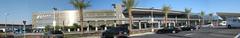 FlyAway bus station at Van Nuys California airport with bus and passengers