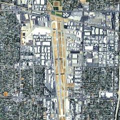 Aerial orthophoto of Van Nuys Airport in California showing runways, taxiways, and surrounding buildings