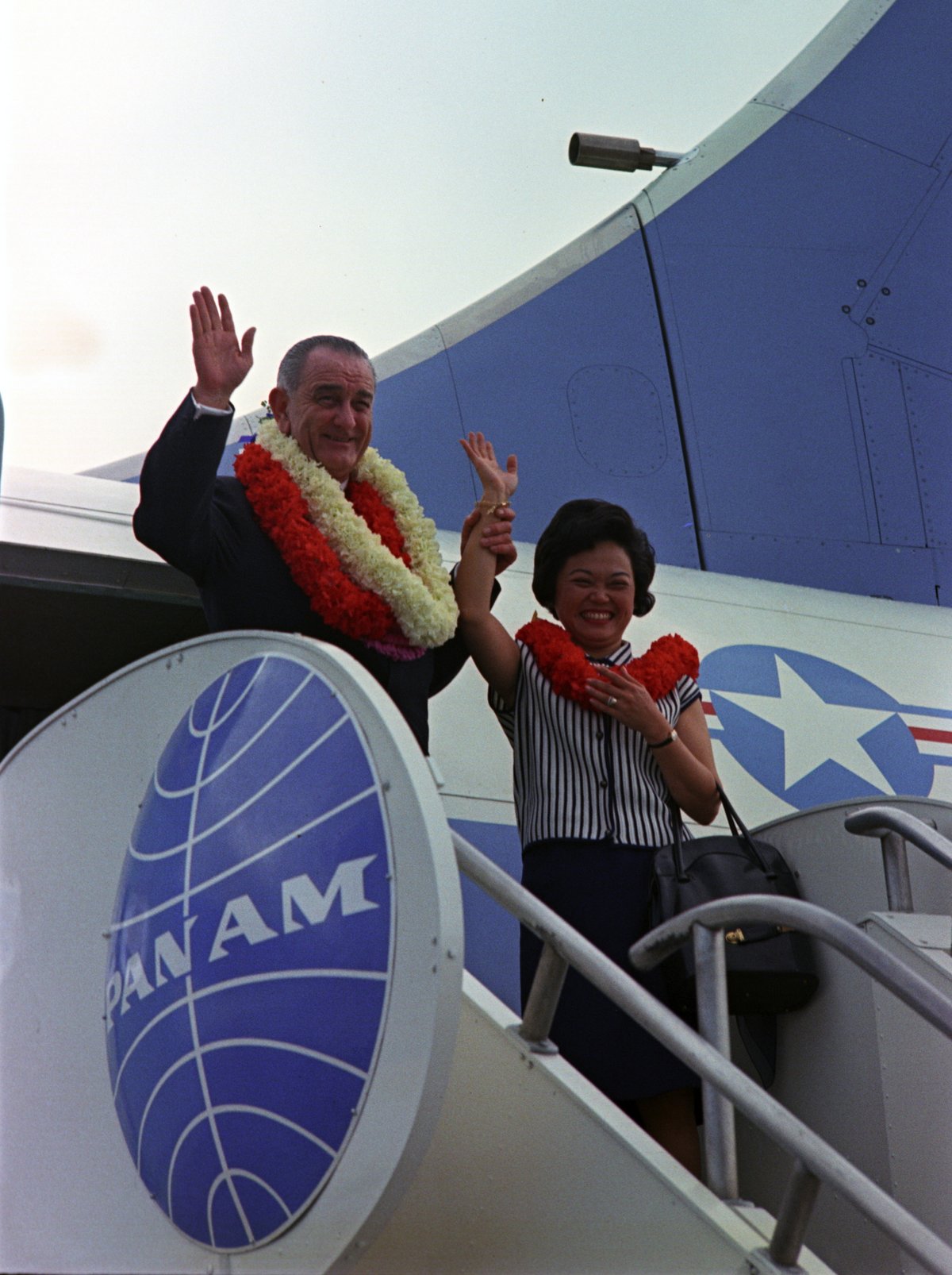 Congresswoman Patsy Mink of Hawaii standing next to President Lyndon B. Johnson at Honolulu International Airport