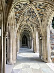 Gothic-style stone cloister with arches at Duke Chapel on West Campus, Duke University in Durham, North Carolina